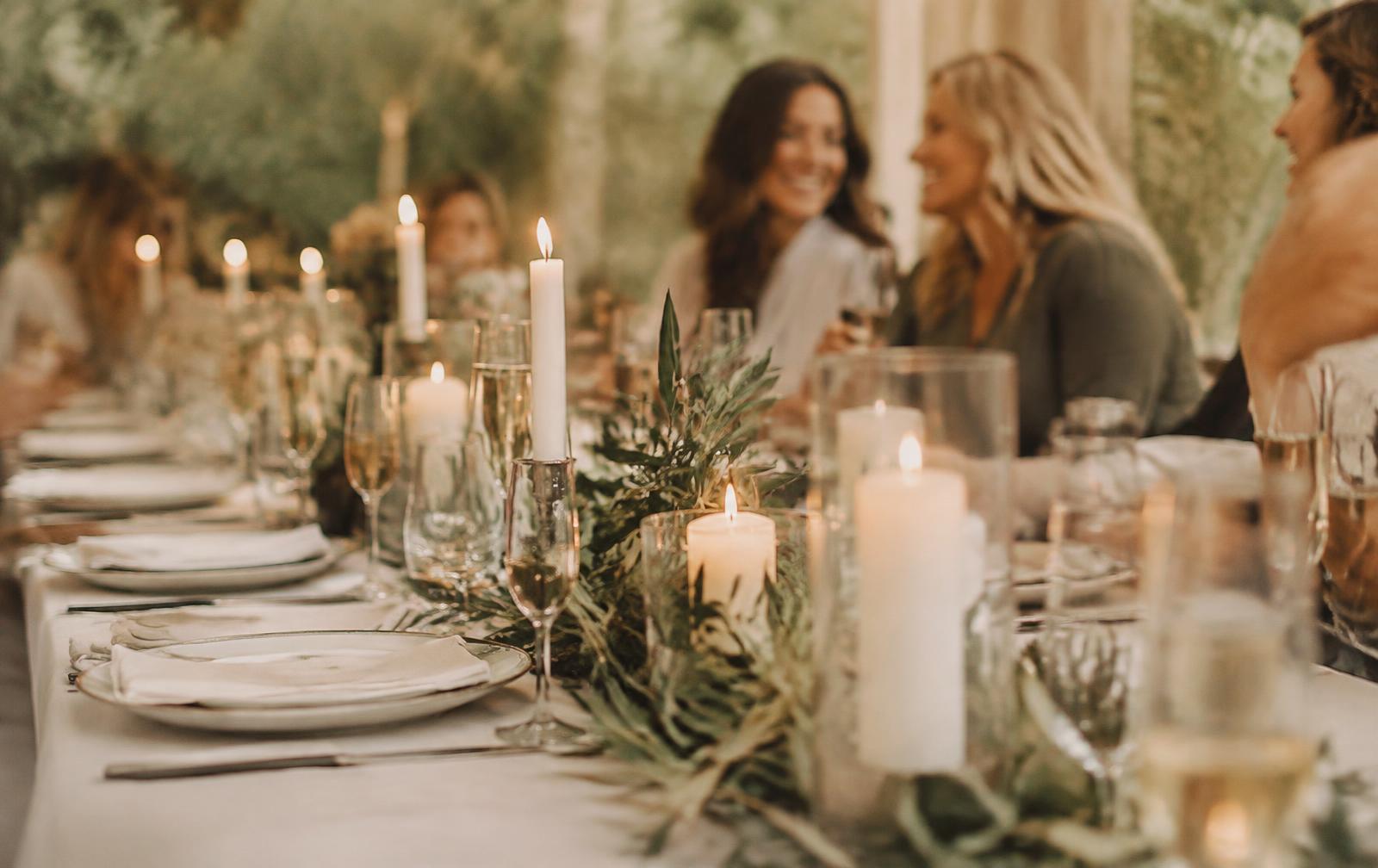 A candlelit table set for a Founded gathering